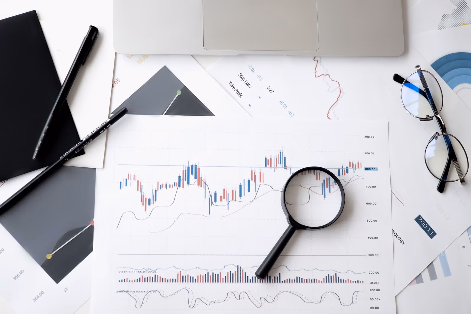 Magnifying glass on a financial chart — reporting questionable asset protection planning